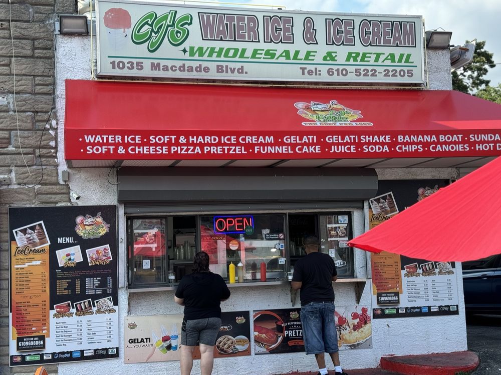 CJ's Waterice and Ice Cream storefront with the service window, menu boards, and red awning.