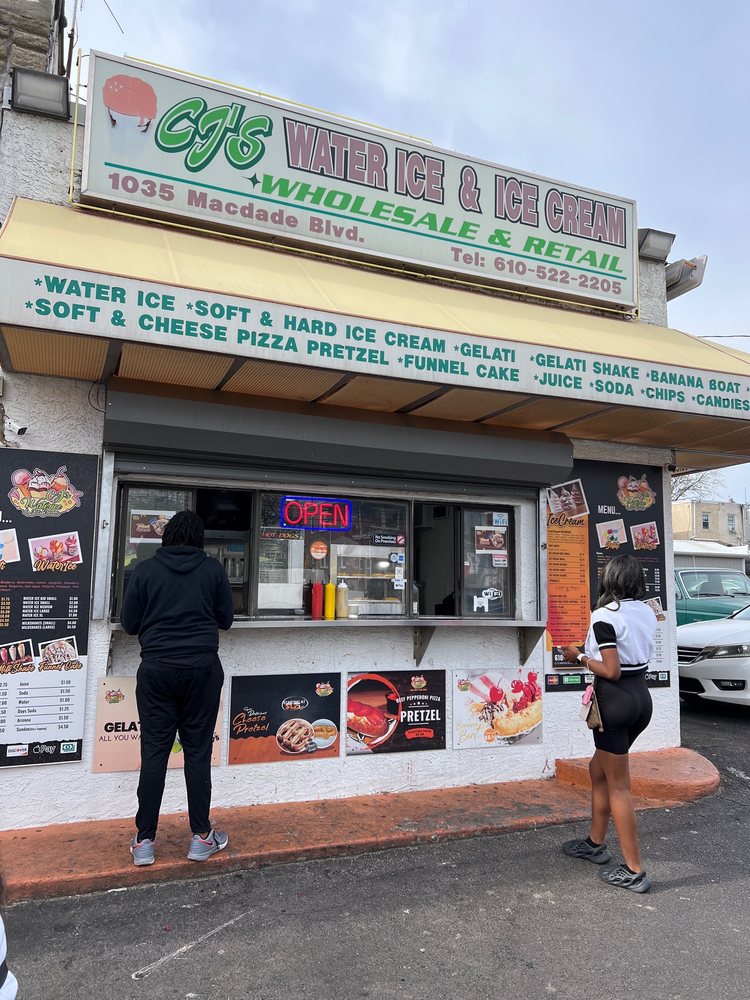 Customers ordering at CJ's Waterice and Ice Cream walk-up window.